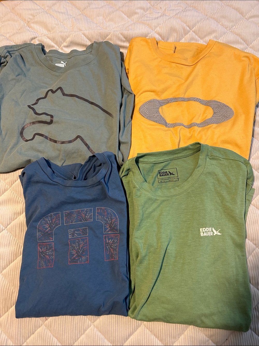 Puma, Eddie Bauer, Oakley, and Travis Mathew all large shirts